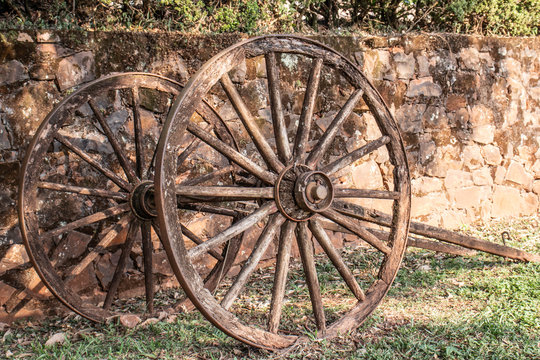 wagon wheel parking on grass with stone wall background in Brazil