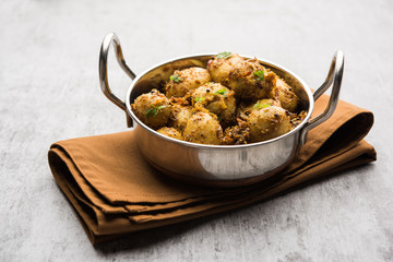 Jeera Aloo - Potatoes Flavoured With Cumin seeds and spices. popular Indian main course recipe. served in a bowl. selective focus