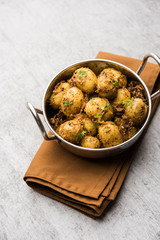 Jeera Aloo - Potatoes Flavoured With Cumin seeds and spices. popular Indian main course recipe. served in a bowl. selective focus