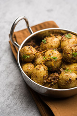 Jeera Aloo - Potatoes Flavoured With Cumin seeds and spices. popular Indian main course recipe. served in a bowl. selective focus