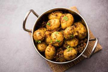 Jeera Aloo - Potatoes Flavoured With Cumin seeds and spices. popular Indian main course recipe. served in a bowl. selective focus