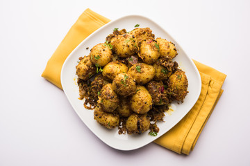 Jeera Aloo - Potatoes Flavoured With Cumin seeds and spices. popular Indian main course recipe. served in a bowl. selective focus