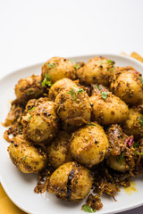 Jeera Aloo - Potatoes Flavoured With Cumin seeds and spices. popular Indian main course recipe. served in a bowl. selective focus