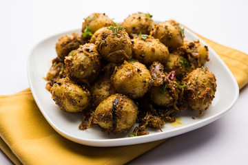 Jeera Aloo - Potatoes Flavoured With Cumin seeds and spices. popular Indian main course recipe. served in a bowl. selective focus