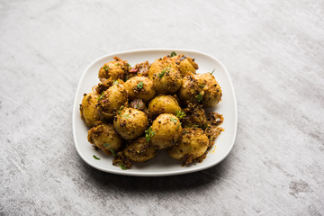 Jeera Aloo - Potatoes Flavoured With Cumin seeds and spices. popular Indian main course recipe. served in a bowl. selective focus