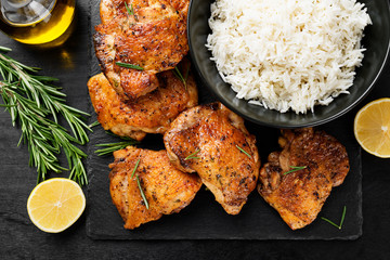 Grilled chicken thighs with spices and lemon. Top view