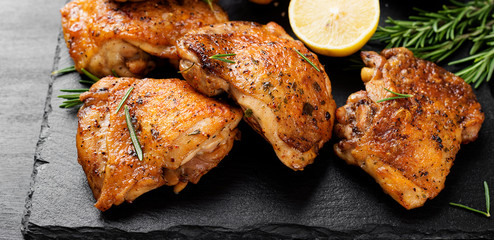 Grilled chicken thighs with spices and lemon.  - 309544968