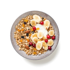 Healthy breakfast. Fresh granola, muesli with yogurt banana and cranberry isolated on white background
