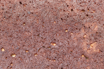 Photo brown pie shot close up, porous texture, background. The view from the top