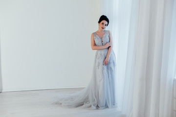 brunette woman in gray wedding gown white