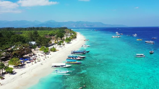 Boats Docked On The Sandy Shore Of Tropical Paradise Famous For Its Crystal Clear Sea Water And Lush Trees, Kalanggaman Island In The Philippines - Aerial Shot