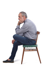 portrait of middle aged man sitting  on white