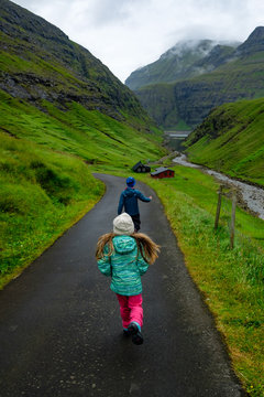 Children Hiking In Saksun, Faroe Islands