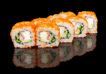 sushi and rolls with different fillings on a black background with reflection