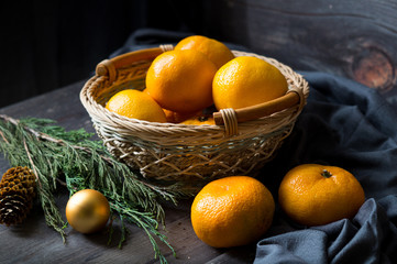 Ripe large tangerines in a wicker basket