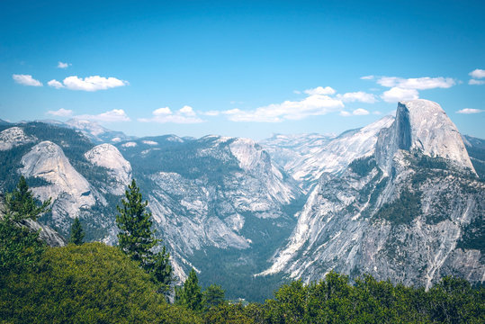Panoramic view from Glacier Point over Yosemite Valley. Yosemite Valley is a glacial valley in Yosemite National Park in the western Sierra Nevada mountains of Northern California.