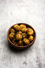 Jeera Aloo - Potatoes Flavoured With Cumin seeds and spices. popular Indian main course recipe. served in a bowl. selective focus