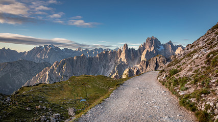 Mountains trail to Tre Cime in Dolomites at sunrise