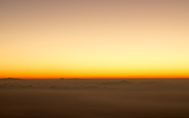 Fototapeta na wymiar golden twilight sky with smooth calm cloud scene 