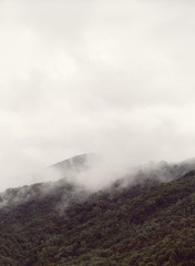 Hills hidden by fog on a cold autumn morning