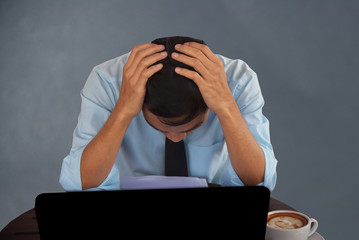 Businessman sitting sad business fail  empty background copy spec