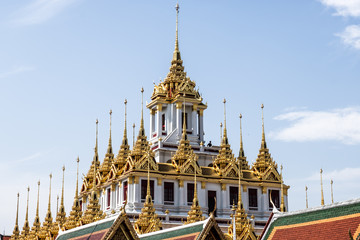 Fototapeta premium Temple roof in Bangkok Thailand. Blue sky blackgroud.