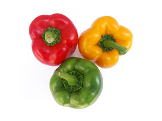 Obraz na płótnie Canvas Fresh green, yellow and red bell peppers, top view, isolated on white background