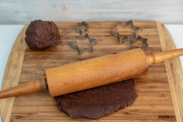 making Christmas butter cookies with cinnamon and chocolate