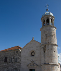Fototapeta na wymiar Boka Kotorska bay on the Montenegrin coast. Church of Mother of God on the Rock.