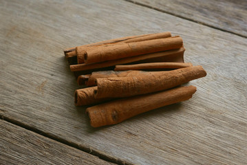 Cinnamon stick on wooden background.