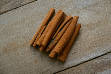 Cinnamon stick on wooden background.