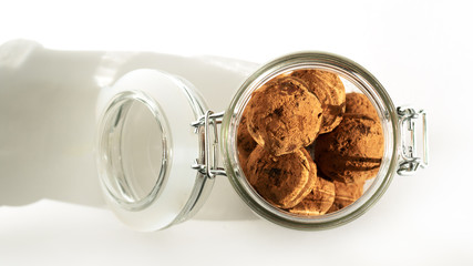 Energy balls in a jar with a yoke lock. Sharp shadows in daylight. Top view