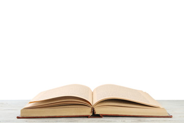 Fototapeta premium Open old hardcover book on wooden table