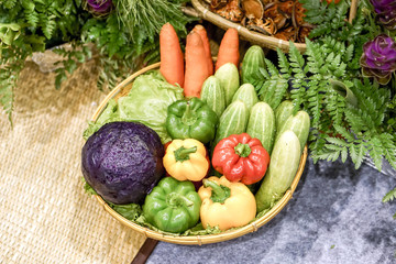 Sample Vegetables that are beneficial to the body (Colorful Bell peppers, Cucumbers, Purple cabbages and Carrot) show in food and market fair.