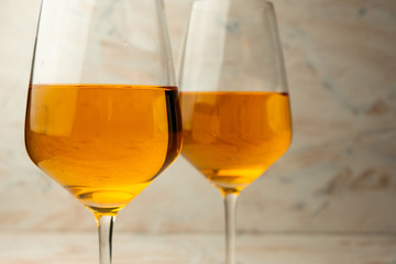 tall glass of rich orange wine