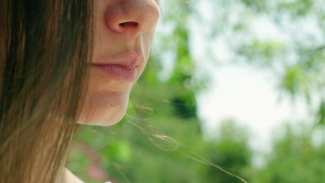 Close up of pretty lady eating outdoors. Barcelona. Spain. 4K