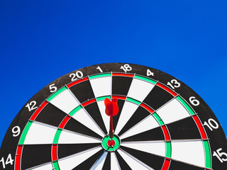 Dart Board Isolated on blue sky background, Setting challenging business goals And ready to achieve...