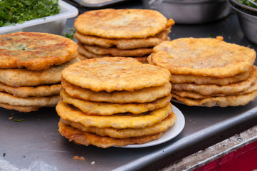 Sale of tortillas in the food market in China, street food in the summer