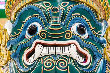 Antique Thai face giant. At Suvarnabhumi airport Thailand.
