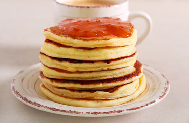 Pancakes with apricot jam served