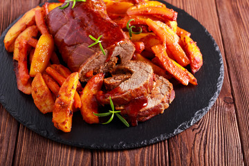 Meat roll with cranberry sauce, potato, carrot