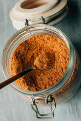 Panela sugar background. Close up view of raw cane sugar in a jar. 