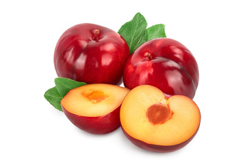 fresh red plum and half with leaves isolated on white background