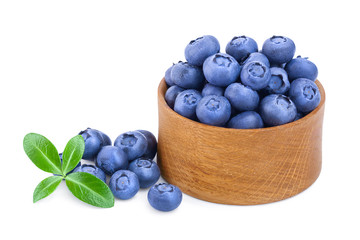 fresh ripe blueberry in wooden bowl isolated on white background