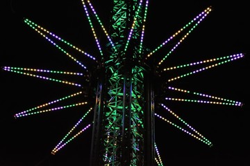 carousel tower in a theme park at night