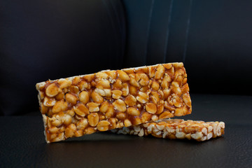 peanut chikki or Groundnut sweet cake.   India traditional sweet and is usually made by jaggery and peanuts.