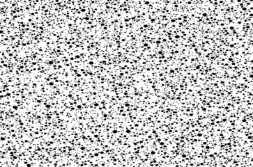 Small uneven spots and particles of debris. Abstract vector texture.  Distressed uneven background. Grunge texture overlay with fine grains isolated on white background. Vector illustration. EPS10.