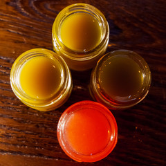 Multicolored cocktails at the bar. Party cocktails and longdrinks with ice garnished with fruits.