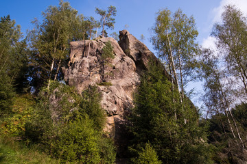 Fototapeta premium Stone rocks Ternoshorska Lada amidst beautiful scenic Carpathian forests. Symbol of motherhood and fertility, Kosiv region, Ivano-Frankivsk Oblast, Ukraine