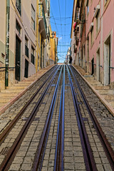 Naklejka premium Narrow street with railway
